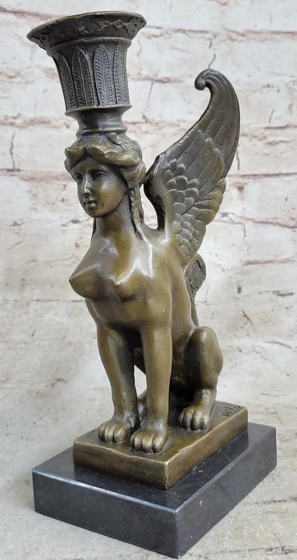 Art Deco Female Sphinx Bronze Statue - 9" x 4": Art Deco Female Sphinx Bronze Statue - 9" x 4" This elegant candle holder showcases the Sphinx, a mythical Greek creature famed for riddles and a lethal embrace. The bronze sculpture captures