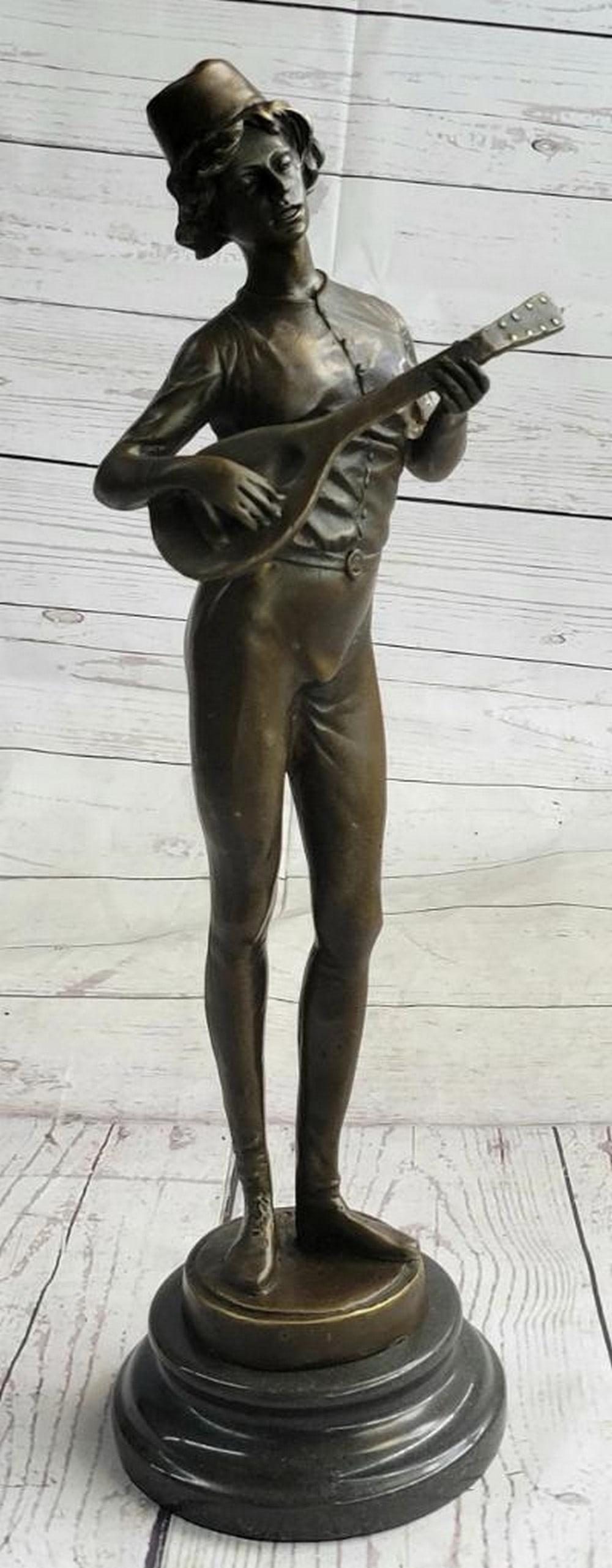 Musician Playing the Lute Inspired Bronze Statue - 17" x 4.5": Musician Playing the Lute Inspired Bronze Statue - 17" x 4.5" This exceptional bronze sculpture celebrates the joy of music through the portrayal of a banjo player immersed in his craft. Wit