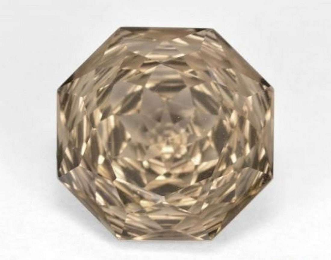 6.43 ct Natural Wood Brown Smoky Quartz, Emerald Cut, VVS: 6.43 ct Natural Wood Brown Smoky Quartz, Emerald Cut, VVS Natural smoky quartz weighing 6.43 carats, cut in an emerald-style octagon concave cut with a wood brown color. The gem measures 12.01 x 11.76