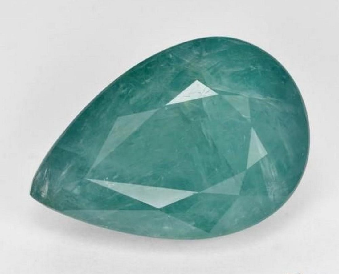 10.02 ct Pear Natural Blue Green Grandidierite: 10.02 ct Pear Natural Blue Green Grandidierite Introducing the Pear Natural Blue Green Grandidierite, a rare and captivating gemstone with a striking blue-green hue and pear-shaped facets. This untrea