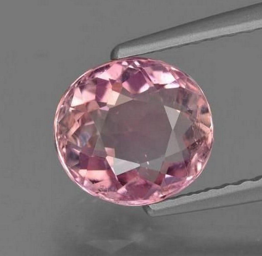 1.58 ct Natural Light Pink Tourmaline, Oval Facet, VS, Mozambique: 1.58 ct Natural Light Pink Tourmaline, Oval Facet, VS, Mozambique Natural tourmaline gemstone weighing 1.58 ct, cut in an oval facet shape with a light pink color. The gem measures 7.55 x 6.94 x 4.42