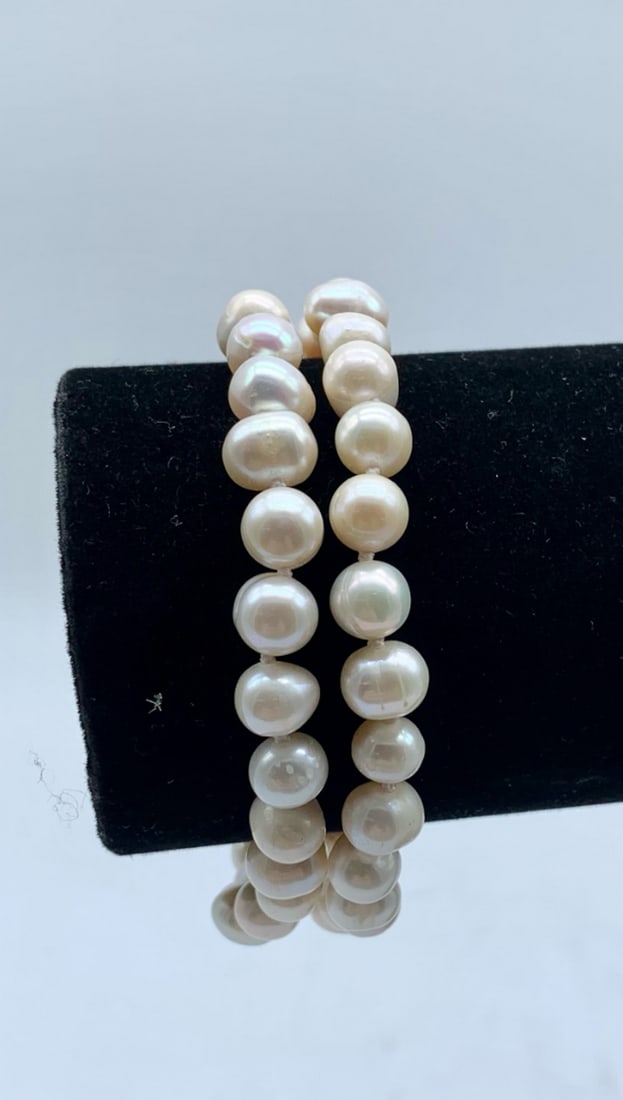 8" White 7mm-8mm Freshwater Double Strand Pearl Bracelet - 50 Pearls: 8" White 7mm-8mm Freshwater Double Strand Pearl Bracelet - 50 Pearls. A Had Knotted Double Stranded Bracelet That Sports A Precious Circular Gold Tone Push Tab Clasp. An Excellent Add To Some Of T