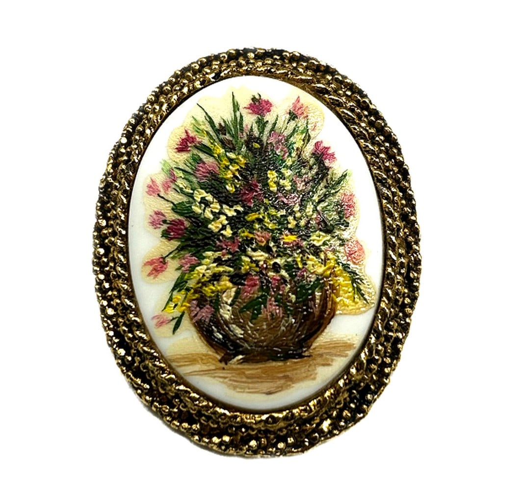Basket of Flowers Hand Painted Brooch: Basket of Flowers Hand Painted Brooch Crafted with meticulous attention to detail, this brooch features a charming basket overflowing with vibrant blooms. Each delicate petal and intricate leaf is ex