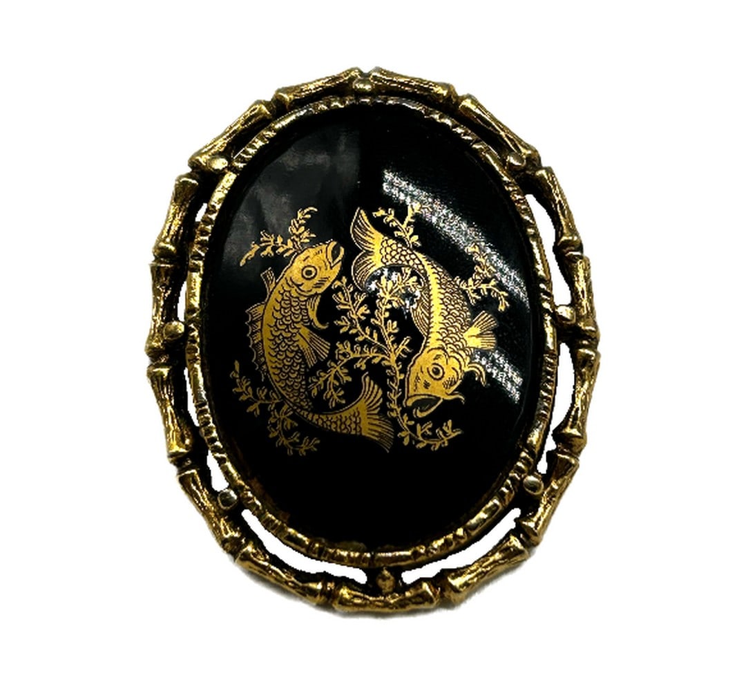 Double Gold Koi Fish Black Background Brooch: Double Gold Koi Fish Black Background Brooch Crafted with meticulous attention to detail, the black enamel face of the brooch serves as a striking backdrop for the intricate gold double koi fish desi