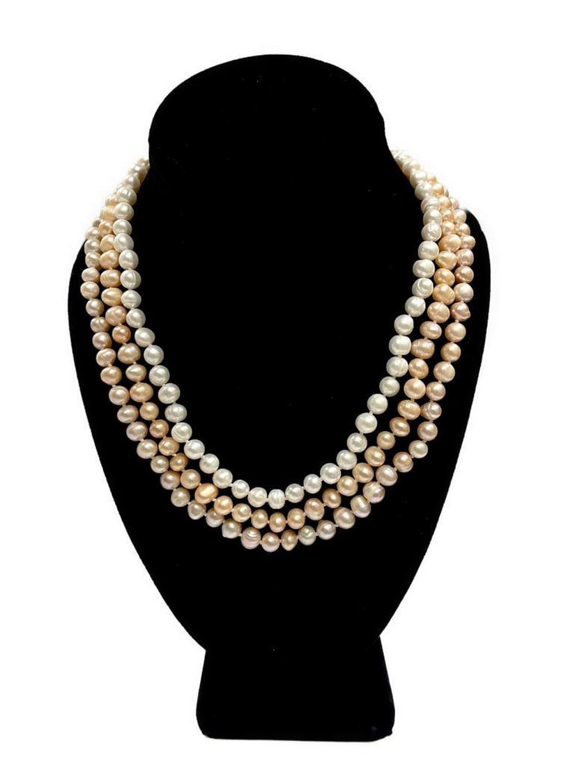 Enchanting Floral Clasp Three-Strand Pink, Purple and White Freshwater Pearl Necklace: Enchanting Floral Clasp Three-Strand Pink, Purple and White Freshwater Pearl Necklace Immerse yourself in the enchanting allure of our Three-Strand Pink, Purple, and White Freshwater Pearl Necklace, a