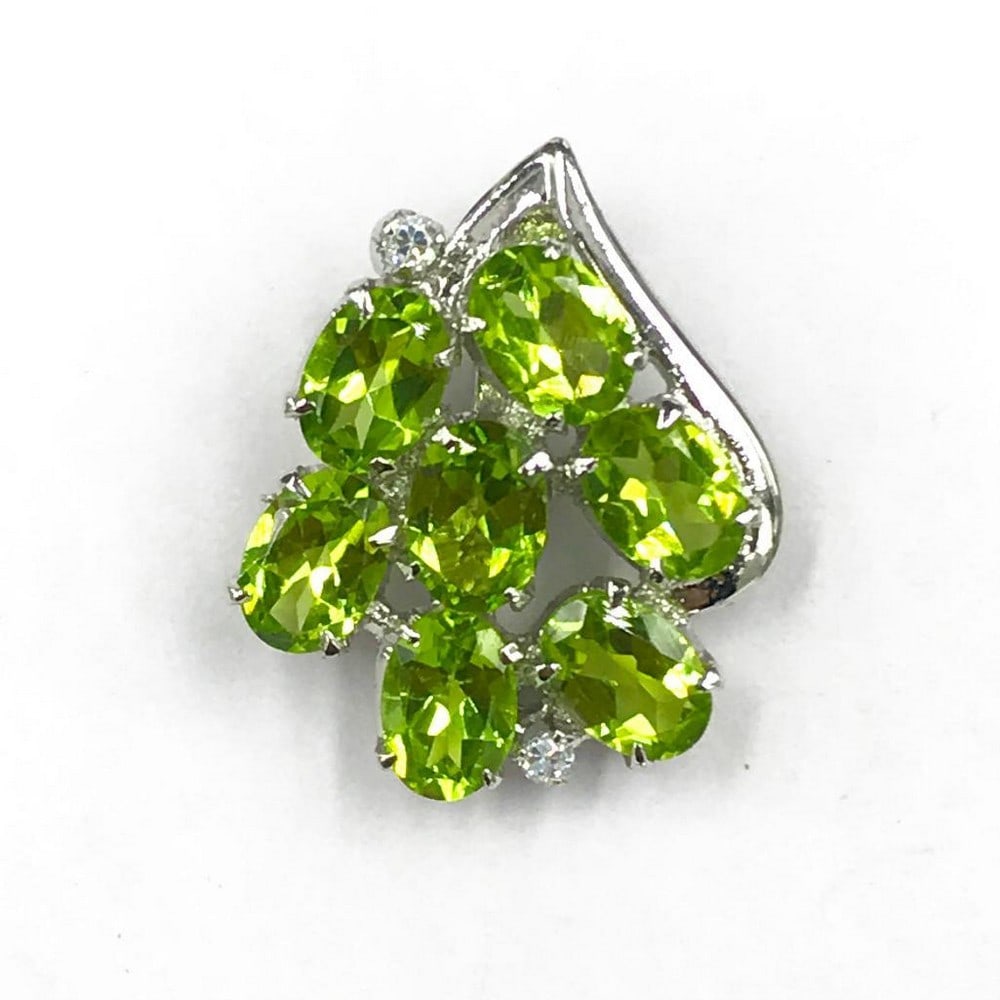 Green Peridot Cluster Necklace Pendant: Green Peridot Cluster Necklace Pendant This pendant features sterling silver accents. View Photos For Further Details