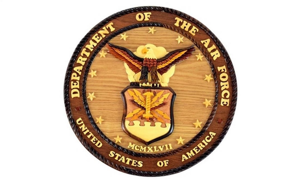 12" United States Air Force Wall Plaque: 12" United States Air Force Wall Plaque This wall plaque features the United States Air Force seal, designed for display in a home, office, or military setting. Crafted from mahogany wood, the pie