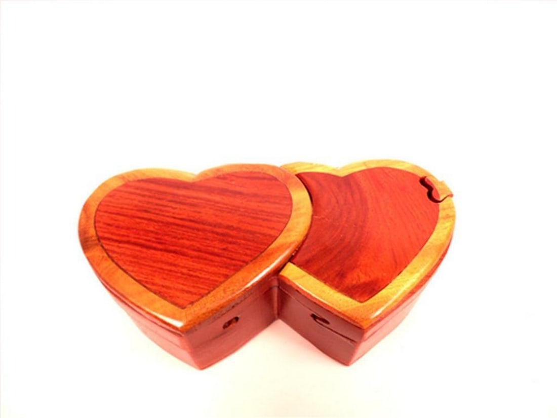Double Heart Puzzle Keepsake Box: Double Heart Puzzle Keepsake Box This keepsake box features a double heart design and is crafted in a puzzle-style format. It is suitable for storing small items such as jewelry or mementos.