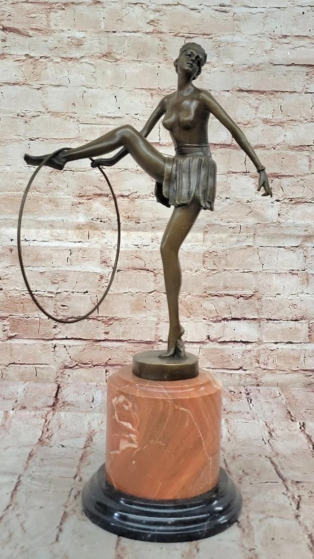 Hula Hoop Dancer Bronze Sculpture by D. Alonzo - 19 1/2" x 9": Hula Hoop Dancer Bronze Sculpture by D. Alonzo - 19 1/2" x 9" This bronze sculpture depicts a dancer in motion, posed with a hula hoop and balanced on her toes. The composition emphasizes move