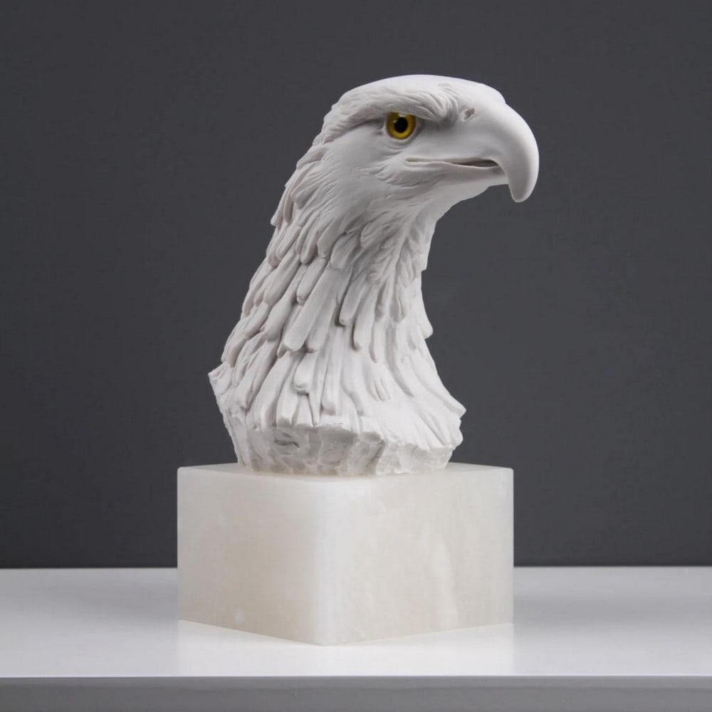 Eagle Head Guardian Sculpture - ( 8.1lbs): Eagle Head Guardian Sculpture - ( 8.1lbs) Introducing our Eagle Statue, a regal embodiment of grandiosity and symbolism. This finely crafted masterpiece captures the majestic demeanor of the eagle, sy