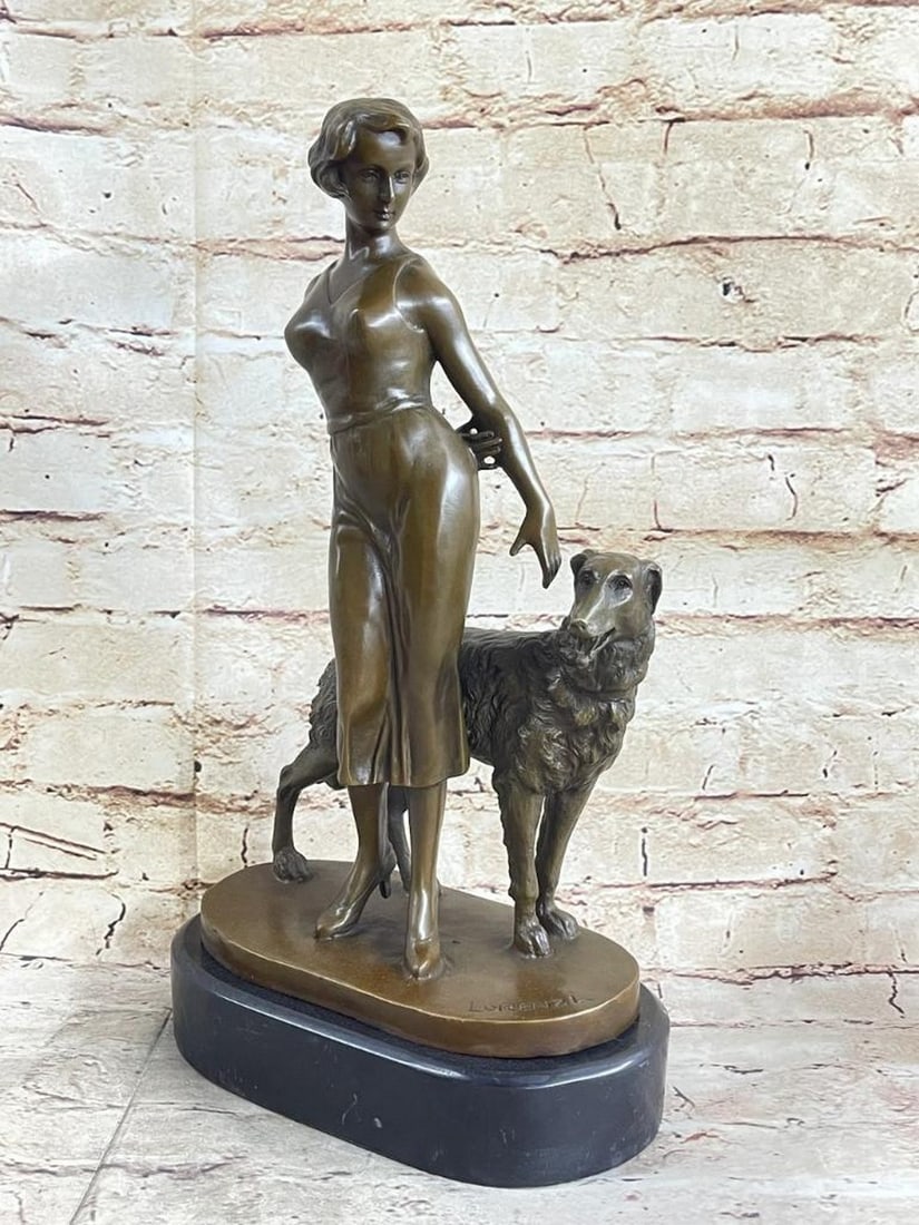 Female Dog Trainer Inspired Bronze Statue - 14.5" x 8.5": Female Dog Trainer Inspired Bronze Statue - 14.5" x 8.5" This bronze statue is a tribute to the bond between a female dog trainer and her attentive canine companion. The trainer stands uprigh
