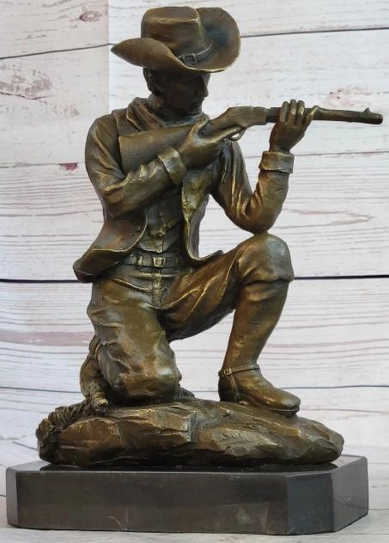 Figure of a Kneeling Ranger With Rifle Bronze Sculpture: Figure of a Kneeling Ranger With Rifle Bronze Sculpture Here is a wonderful sculpture of a Cowboy shooting a rifle in the old west, in mid-run shooting range with his arch enemy. The detail of this s