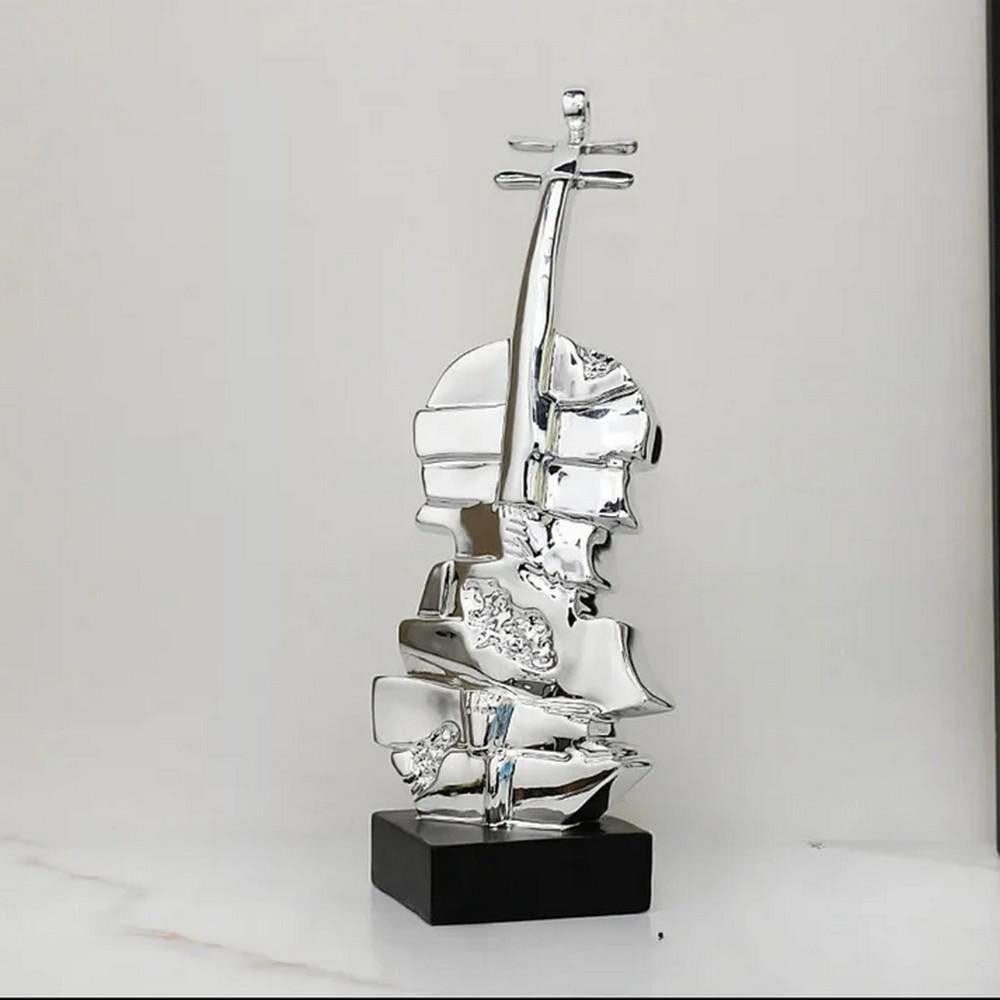 Resonant Form Sculpture: Resonant Form Sculpture Ideal for bringing a musical flair to your desk, shelf, or living space, this stacked violin sculpture is a true work of art and elegance. It beautifully combines creativity wi