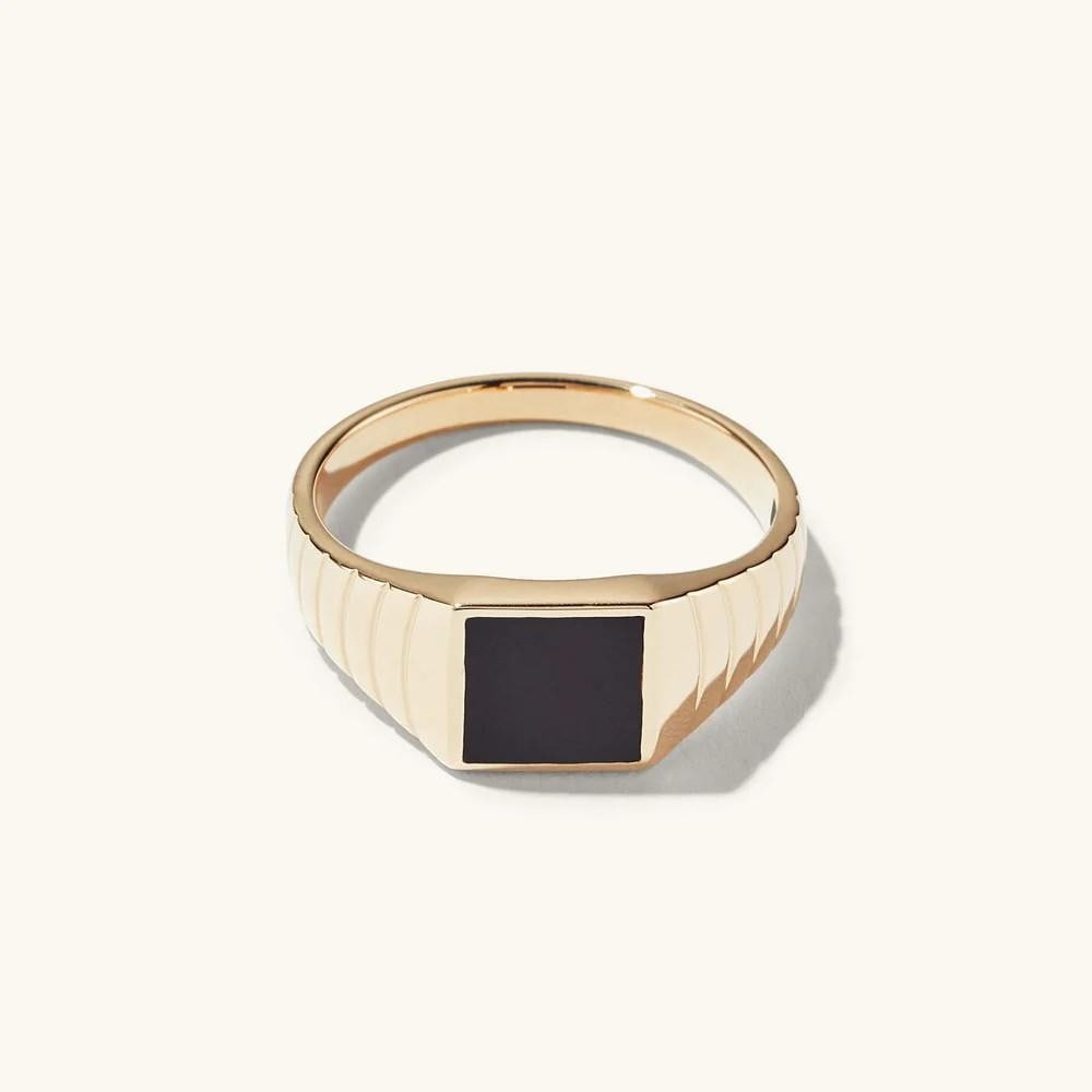 Onyx Edge Signet Ring: Onyx Edge Signet Ring A bold touch of onyx makes a statement, especially when paired with the matching signet ring. Crafted from 14k gold, this piece is designed to last a lifetime when properly cared