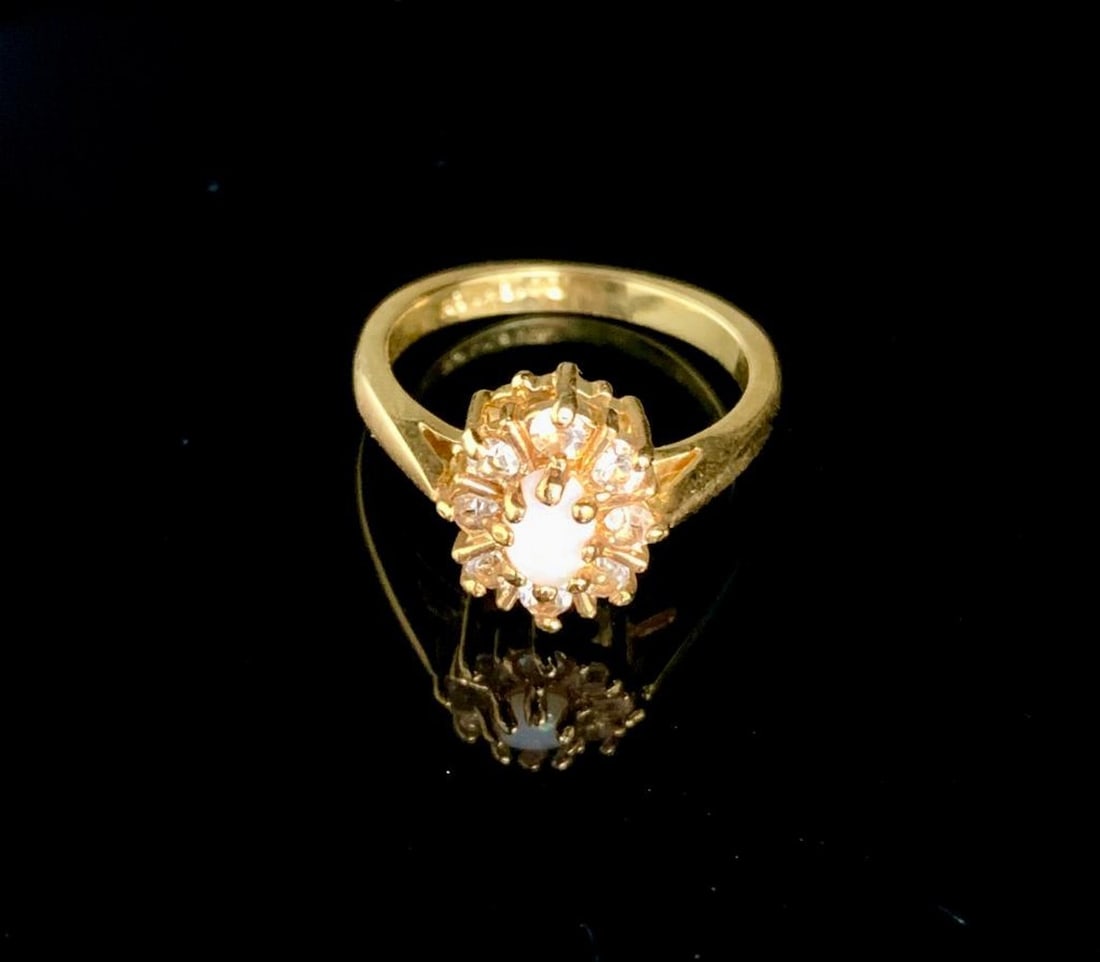 Size 8 0.15ct Oval Cut White Opal in 18K Gold Plated Ring: Size 8 0.15ct Oval Cut White Opal in 18K Gold Plated Ring. Please view photos for further details.