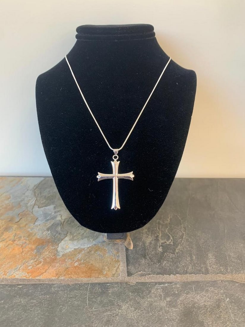 Faith & Light Silver Pendant Necklace: Faith & Light Silver Pendant Necklace Embodying elegance and devotion, this silver cross pendant necklace is a classic symbol of faith. The polished silver pendant shines with a refined simplicity