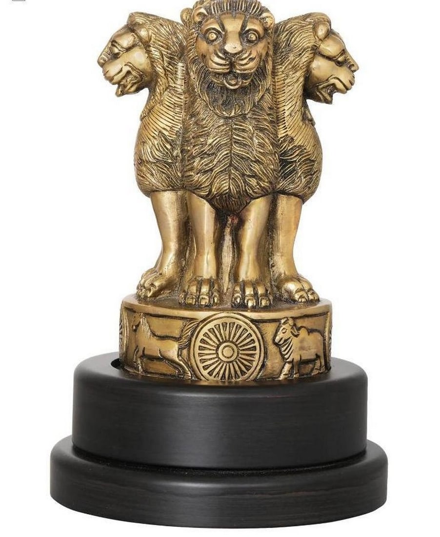 9" Brass Lion Capital National Emblem on Rotating Wooden Base: 9" Brass Lion Capital National Emblem on Rotating Wooden Base This handcrafted brass and wood statue is a finely detailed replica of the Sarnath Lion Capital, the national emblem of India. The fou