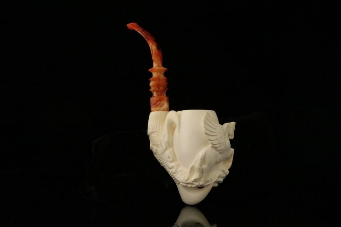 Pegasus Claw Figure Carved Meerschaum Pipe with Fitted Case: Pegasus Claw Figure Carved Meerschaum Pipe with Fitted Case This hand-carved meerschaum pipe features a dynamic Pegasus design held within a detailed claw, highlighting exceptional craftsmanship and