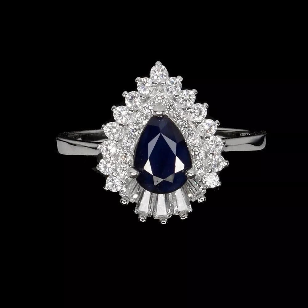 Pear Blue Sapphire 925 Sterling Silver Ring - Size 6.5: Pear Blue Sapphire 925 Sterling Silver Ring - Size 6.5 This stunning 925 sterling silver ring showcases a beautiful pear-shaped blue sapphire gemstone, measuring 7x5mm. The vibrant blue hue of the sa