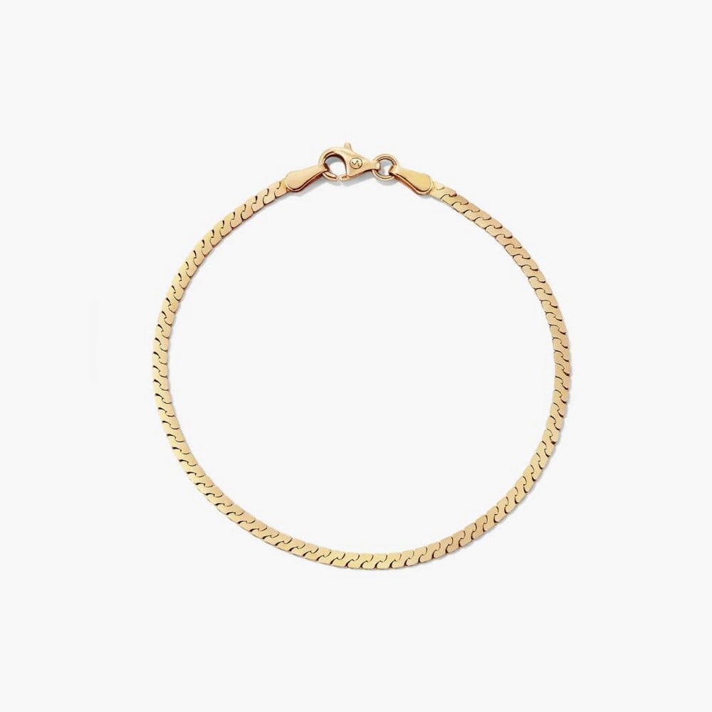 14k Yellow Gold Braided Link Chain Bracelet: 14k Yellow Gold Braided Link Chain Bracelet Sleek, slinky, and statement-making, this bracelet features flat, braided links designed for comfortable all-day wear. Its timeless design pairs effortless