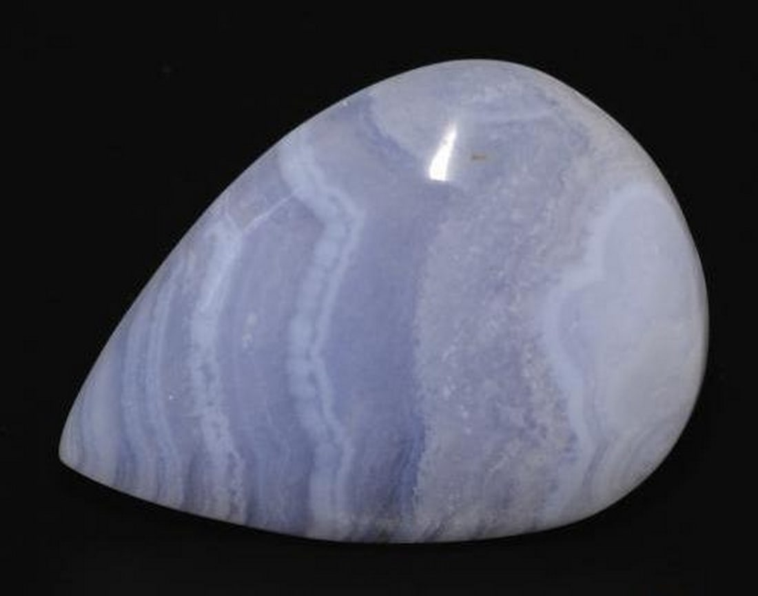 21.94 ct Natural Violet Blue Chalcedony, Pear Cabochon, Opaque, Brazil: 21.94 ct Natural Violet Blue Chalcedony, Pear Cabochon, Opaque, Brazil Natural chalcedony weighing 21.94 carats, cut in a pear cabochon with violet blue color. The gem measures 27.63 x 20.06 x 5.73 m