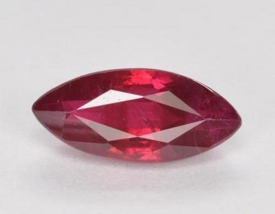 1.06ct Natural Blood Red Ruby, Marquise, SI, Myanmar: 1.06ct Natural Blood Red Ruby, Marquise, SI, Myanmar Natural ruby gemstone weighing 1.06 carats, cut in a marquise facet with a vivid blood red color and SI clarity. The gem measures approximately 9.0