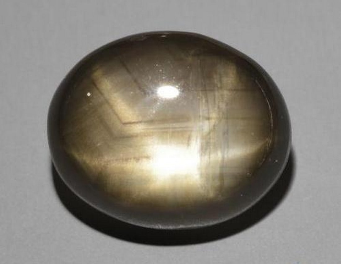 7.80ct Natural Black Star Sapphire, Oval, Opaque: 7.80ct Natural Black Star Sapphire, Oval, Opaque Natural black star sapphire gemstone weighing 7.80 carats, cut in an oval cabochon shape with an opaque black color. The gem measures approximately 11.