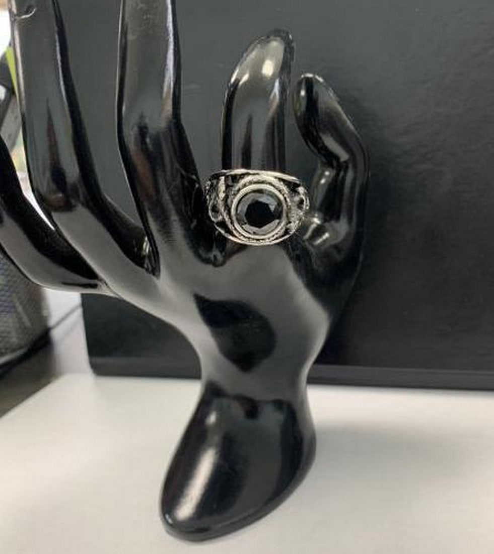 Coiling Snake Ring with Faceted Semi-precious Stone: Coiling Snake Ring with Faceted Semi-precious Stone This striking ring features a coiling snake design, gracefully wrapping around the finger with intricate detail. At its center, a faceted semi-preci