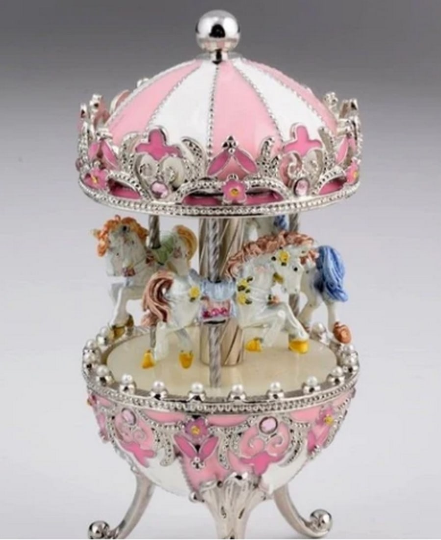 Rosy Fabergé Egg With Wind-Up Horse Carousel: Rosy Fabergé Egg With Wind-Up Horse Carousel Step into a world of luxury and elegance with our meticulously crafted Enamel Painted Trinket Box, adorned with radiant Austrian Crystals. Each piece