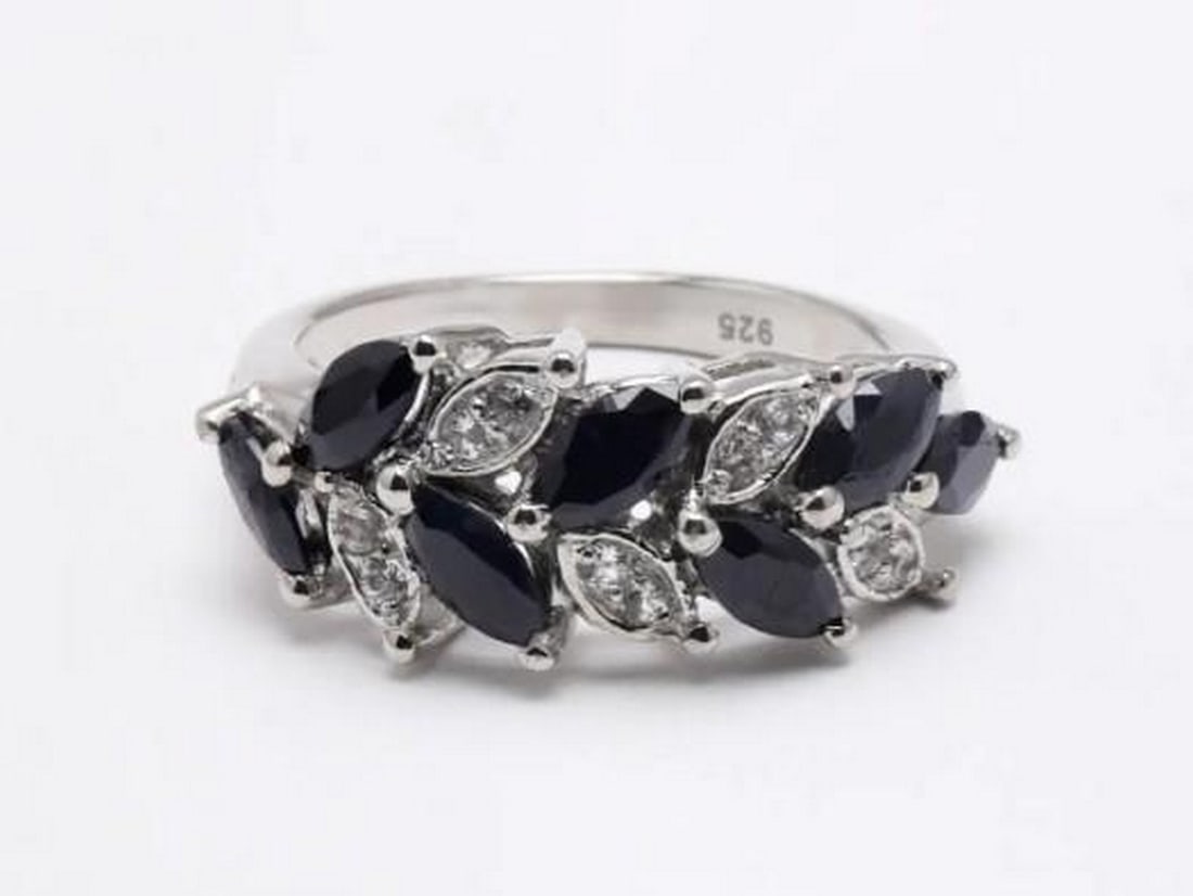 Midnight Leaves: Midnight Leaves — Black Onyx and Cubic Zirconia Ring Embrace the allure of nature with this stunning ring, crafted to resemble a delicate, stylized leaf. The intricate design features a