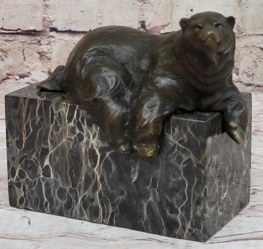 Art Deco Polar Bear Bronze Bookend: Art Deco Polar Bear Bronze Bookend This singular Art Deco bronze bookend, bearing the signature of artist Milo, features a serene polar bear lounging atop its base, captured in a moment of relaxed el