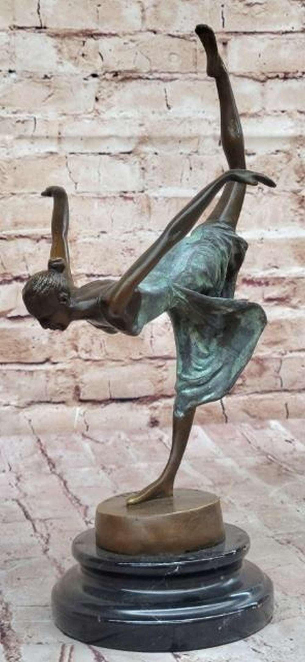Bronze Dancer Girl Sculpture with Green Patina Dress: Bronze Dancer Girl Sculpture with Green Patina Dress Graceful and dynamic, this hot cast bronze sculpture captures a dancer in mid-performance, balancing delicately on one leg with the other extended