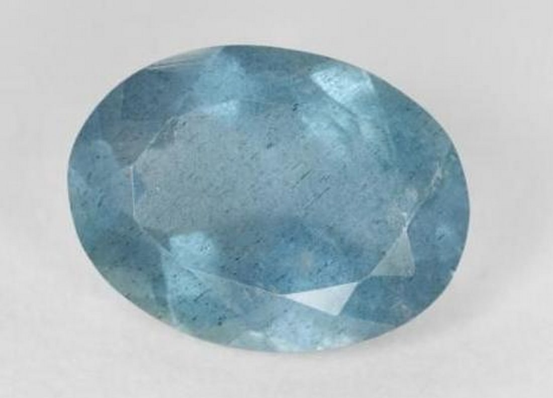Aquamarine Oval Gem: Aquamarine Oval Gemstone Radiating the serene beauty of tranquil waters, this exquisite Aquamarine gemstone features a classic oval faceted cut that enhances its soft, sea-blue brilliance. Known as t