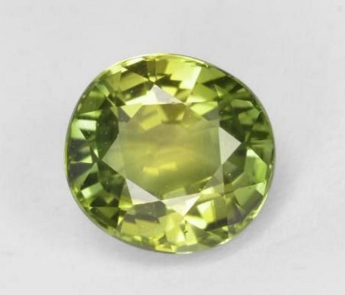 0.98 ct Natural Deep Green Tourmaline – Oval Facet: 0.98 ct Natural Deep Green Tourmaline – Oval Facet Introducing the Natural Deep Green Tourmaline, a striking gemstone that exudes elegance and depth. Its rich deep green hue is beautifully displayed