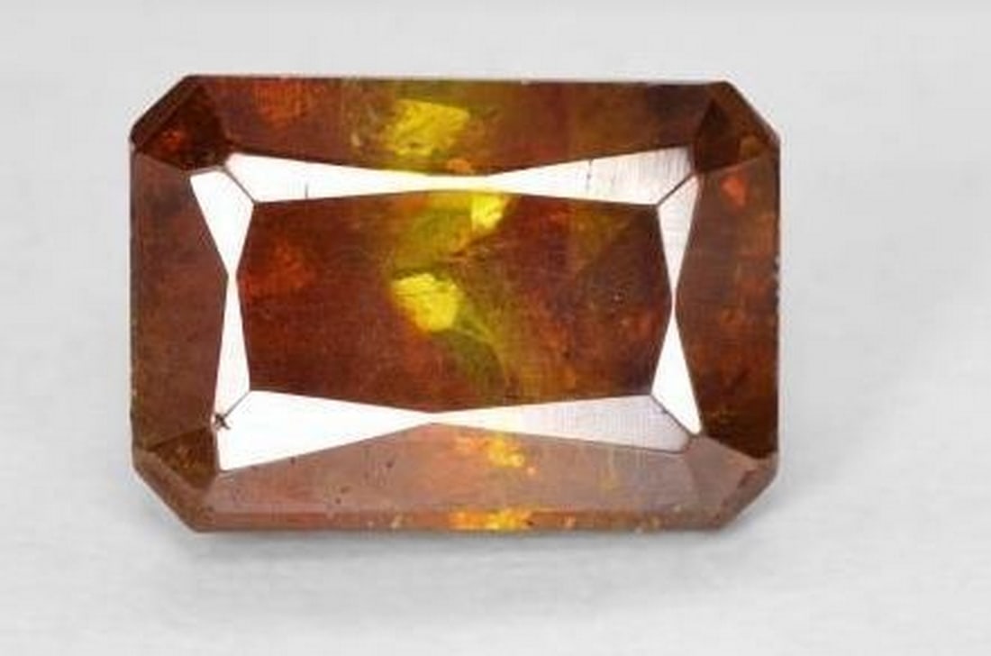 Brilliant Octagon-Cut Brownish Orange Sphalerite Loose Gemstone: Brilliant Octagon-Cut Brownish Orange Sphalerite Loose Gemstone Radiating fiery brilliance, this exquisite loose sphalerite gemstone features a stunning octagon step cut that showcases its