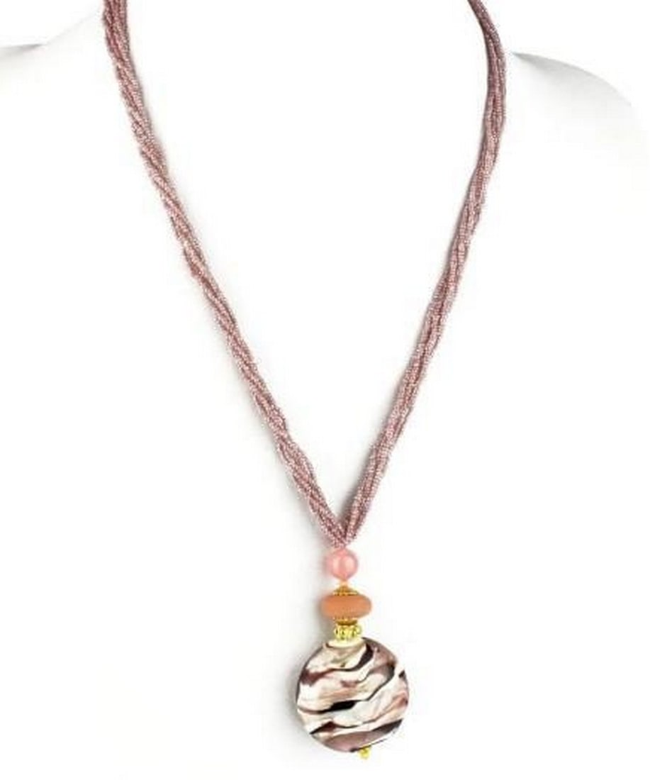 Grande Rosa Murano Bead Necklace: Grande Rosa Murano Bead Necklace Striking in its simplicity, this statement necklace features a single oversized bead of authentic Murano glass in a radiant pink hue. Handcrafted using traditional te