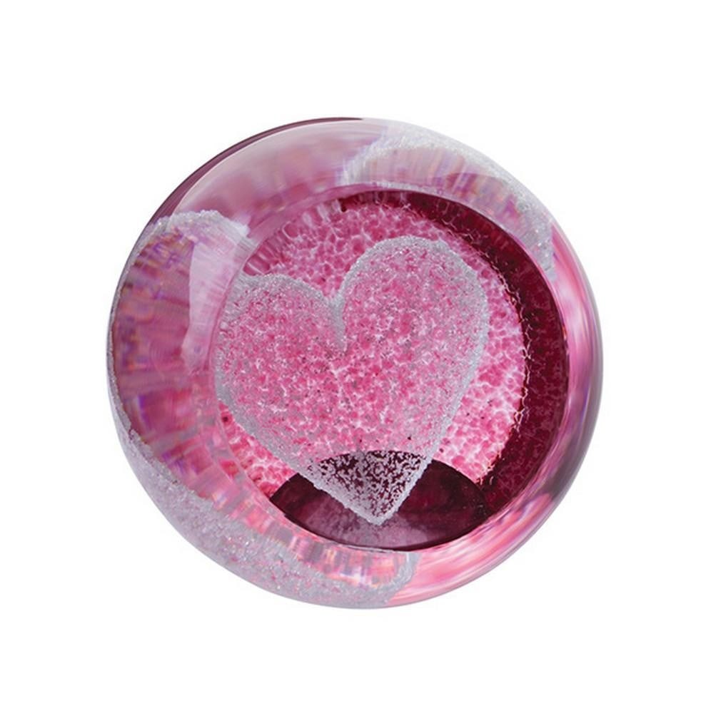 Scarlet Embrace Paperweight: Scarlet Embrace Paperweight A handcrafted glass paperweight featuring a petite heart suspended within a smooth ruby-colored sphere. Created using hot sculpted glass techniques, it embodies timeless
