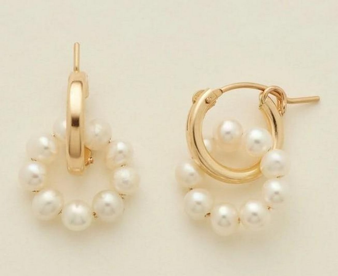 Freshwater Pearl Halo Hoops – 14k Gold Filled: Freshwater Pearl Halo Hoops – 14k Gold Filled A pair of 13mm gold-filled hoop earrings accented with a delicate halo of freshwater pearls. The pearls are evenly spaced along the hoop, creating a