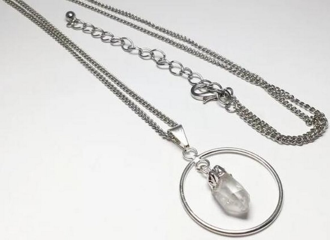 Clear Quartz And Sterling Silver Necklace: Clear Quartz And Sterling Silver Necklace. Elegance meets energy in this necklace, featuring a radiant clear quartz pendant set in sterling silver. Clear quartz amplifies positive energy, enhances cl