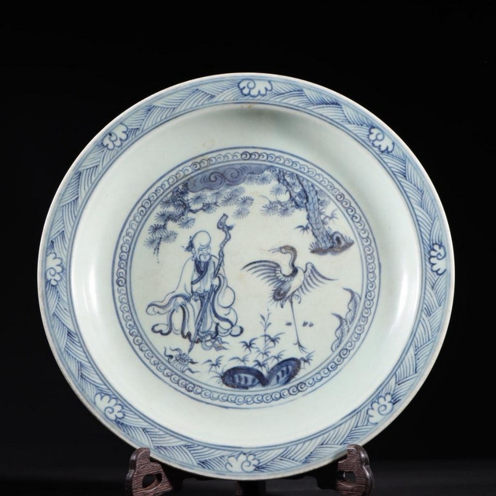 Plate Inspired From The Ming Dynasty Blue And White Figurative Design: Plate Inspired From The Ming Dynasty Blue And White Figurative Design. This ceramic plate draws inspiration from the iconic blue and white porcelain of the Ming Dynasty. Adorned with intricate figura