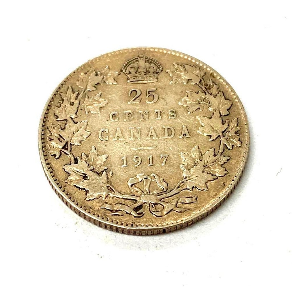 1917 Canadian 25 Cent Coin: Obverse The portrait in left profile of George V is surrounded with the inscription "GEORGIVS V DEI GRA: REX ET IND:IMP" (George V, King and Emperor of India by the grace of God) Lettering: GE