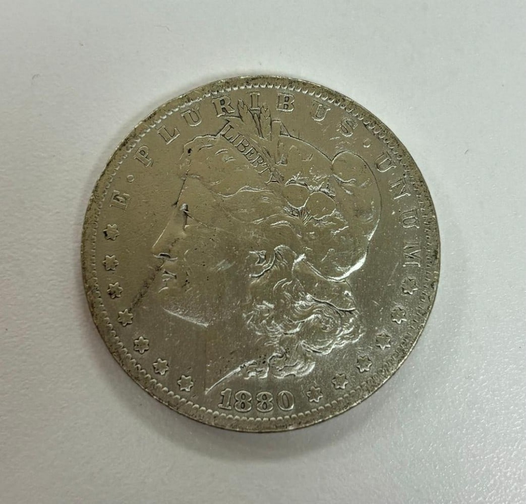 1880 Morgan Silver Dollar: 1880 Morgan Silver Dollar Obverse: Left facing profile of Lady Liberty and the words "Liberty In God We Trust" and the year Reverse: Bald eagle resting on an olive branch and the words 