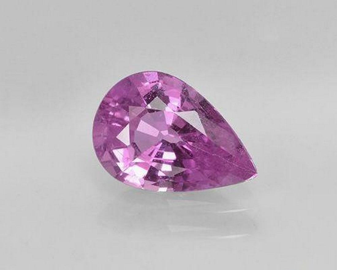 1.06 ct Natural Medium Purple Sapphire, Pear Cut, VS, Tanzania: 1.06 ct Natural Medium Purple Sapphire, Pear Cut, VS, Tanzania Natural sapphire gemstone weighing 1.06 ct, cut in a pear facet shape with a medium purple color. The gem measures 8.16 x 5.57 x 3.32 mm