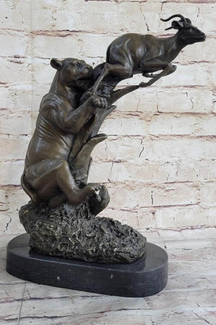 Survival Of The Jaguar & Gazelle Bronze Sculpture - 13" x 12": Jaguar & Gazelle Bronze Sculpture - 13" x 12" This jaguar was lurking in the shadows of his play field and spotted his meal of the day. The baby deer starts to run for his life, but knows