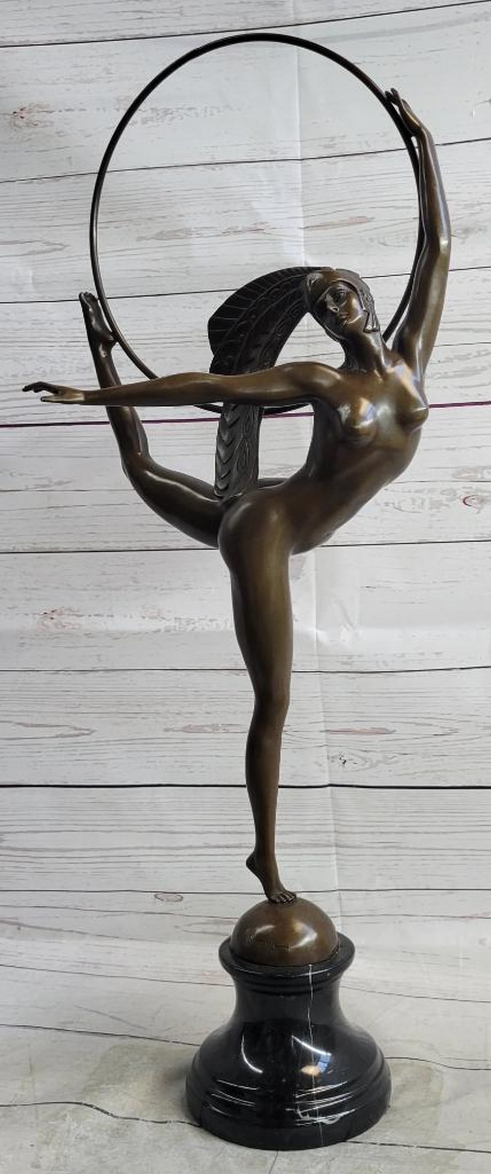 Brazilian Carinval Dancer Female Figure w/ Hula Hoop Bronze Reproduction: Brazilian Carinval Dancer Female Figure w/ Hula Hoop Bronze Reproduction This stunning bronze reproduction sculpture captures the grace and poise of a skilled dancer performing an intricate dance rou
