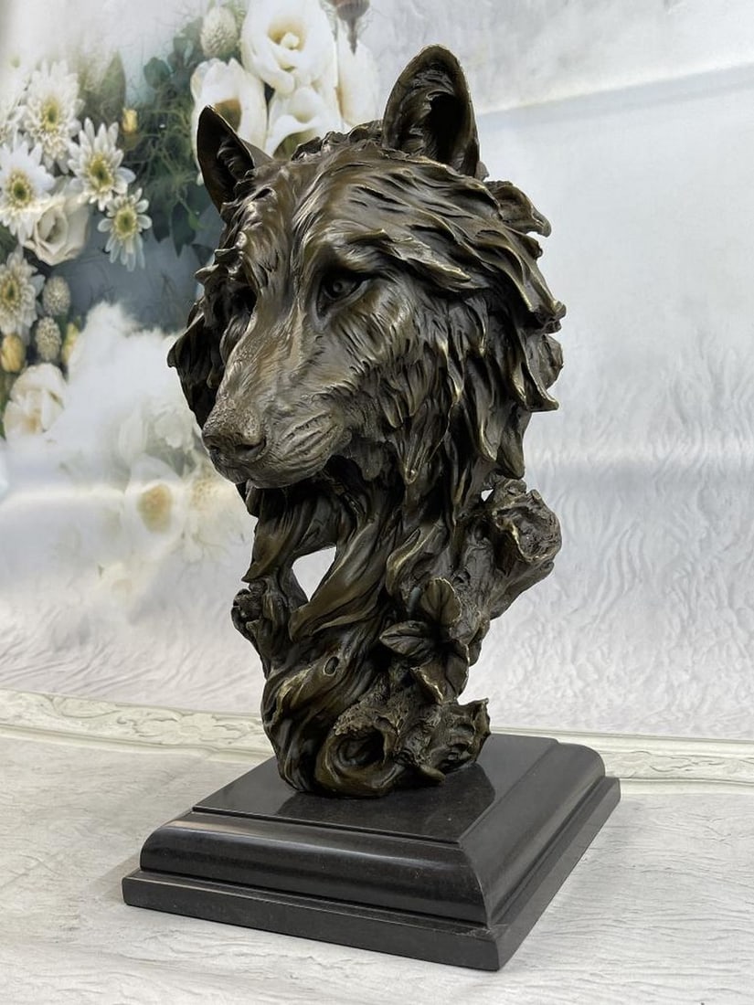 Wolf Head Bust Bronze Sculpture: Wolf Head Bust Bronze Sculpture This sculpture captures the wild dignity of the wolf. The base of the sculpture in its abstract sense resembles that of a winding tree trunk that blooms in