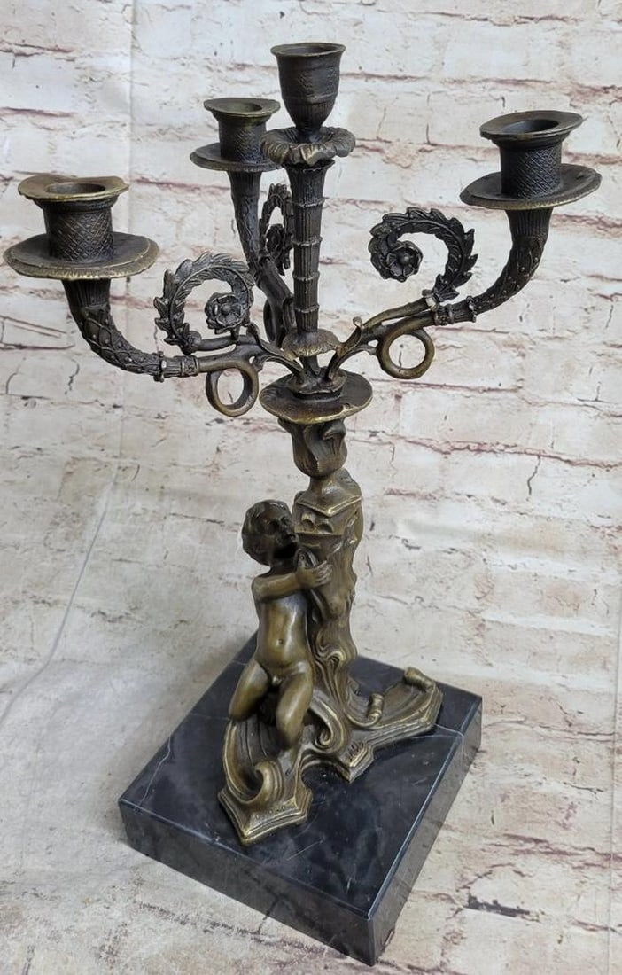 Hot Cast Bronze Cherubim Candelabra Sculpture by Milo – 16" x 8": Hot Cast Bronze Cherubim Candelabra Sculpture by Milo – 16" x 8" This finely detailed bronze sculpture features nude cherubim forming a candelabra, signed by Milo. Crafted using the lost wax