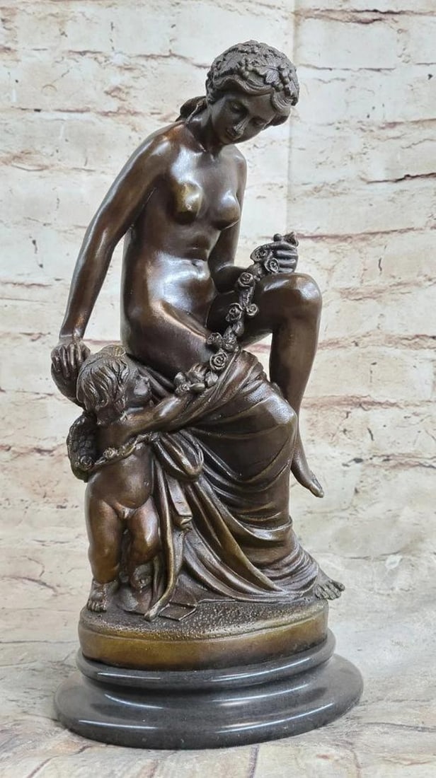 Sculpted Elegance Inspired Bronze Statue: Sculpted Elegance Inspired Bronze Statue A lovely young woman reclines, accompanied by her cherubic baby angel standing at her side, affectionately grasping onto her thigh. The admiration between