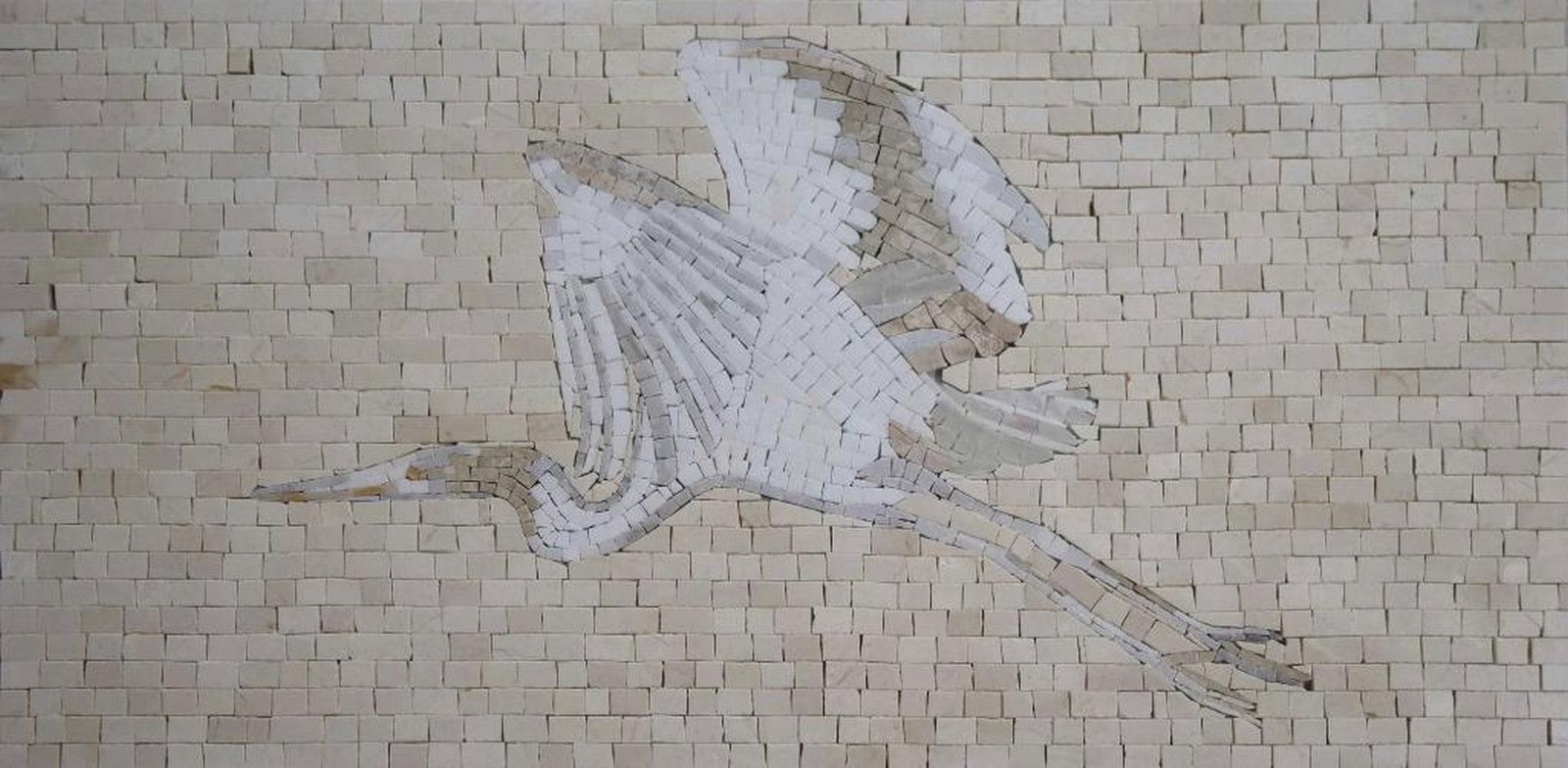 Heron Mosaic: Heron Mosaic A handcrafted marble mosaic depicting a white flying heron in warm white and beige tones. Made from natural stones, this piece highlights texture and detail, capturing the grace and