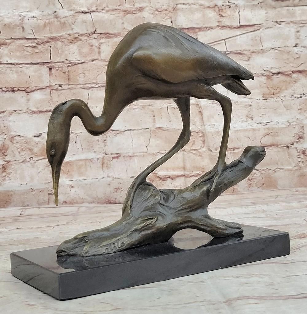 Crane Bronze Sculpture on Marble Base – 9" x 8": Crane Bronze Sculpture on Marble Base – 9" x 8" This bronze sculpture captures a graceful crane in mid-flight, wings outstretched and poised. Cast using the Lost Wax Method with a rich brown